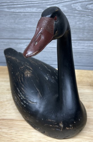 Hand carved black swan - hand,